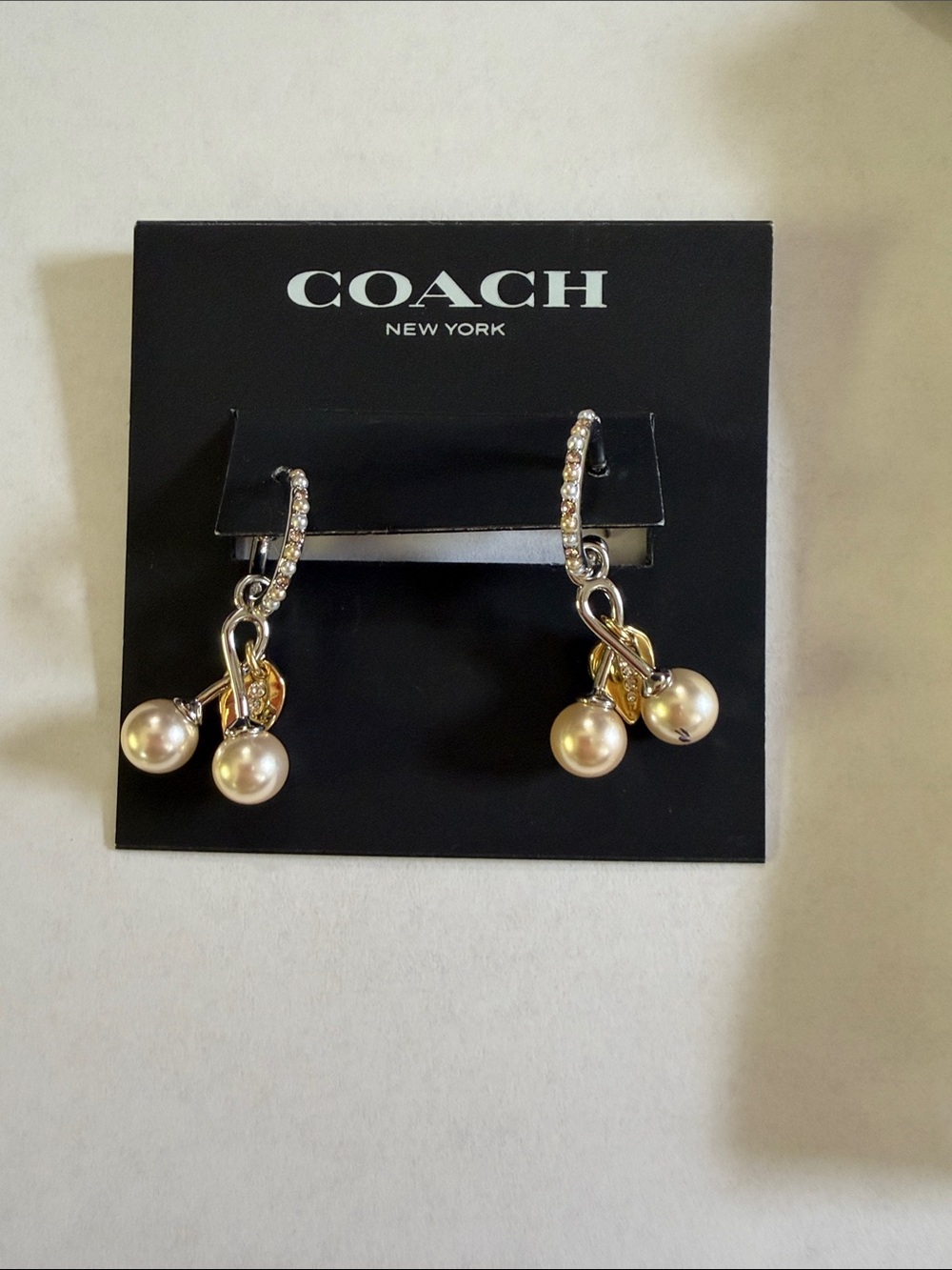 COACH silver tone huggie hoop earrings cream faux pearl cherry charm nwt